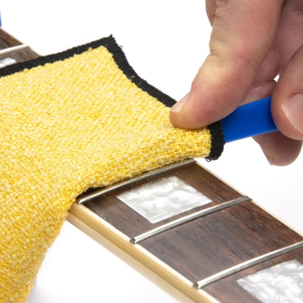 Fretboard brush helps clean and condition