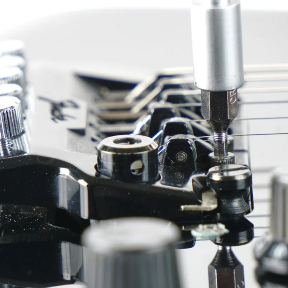 Using Allen Key for Adjusting Guitar Saddle