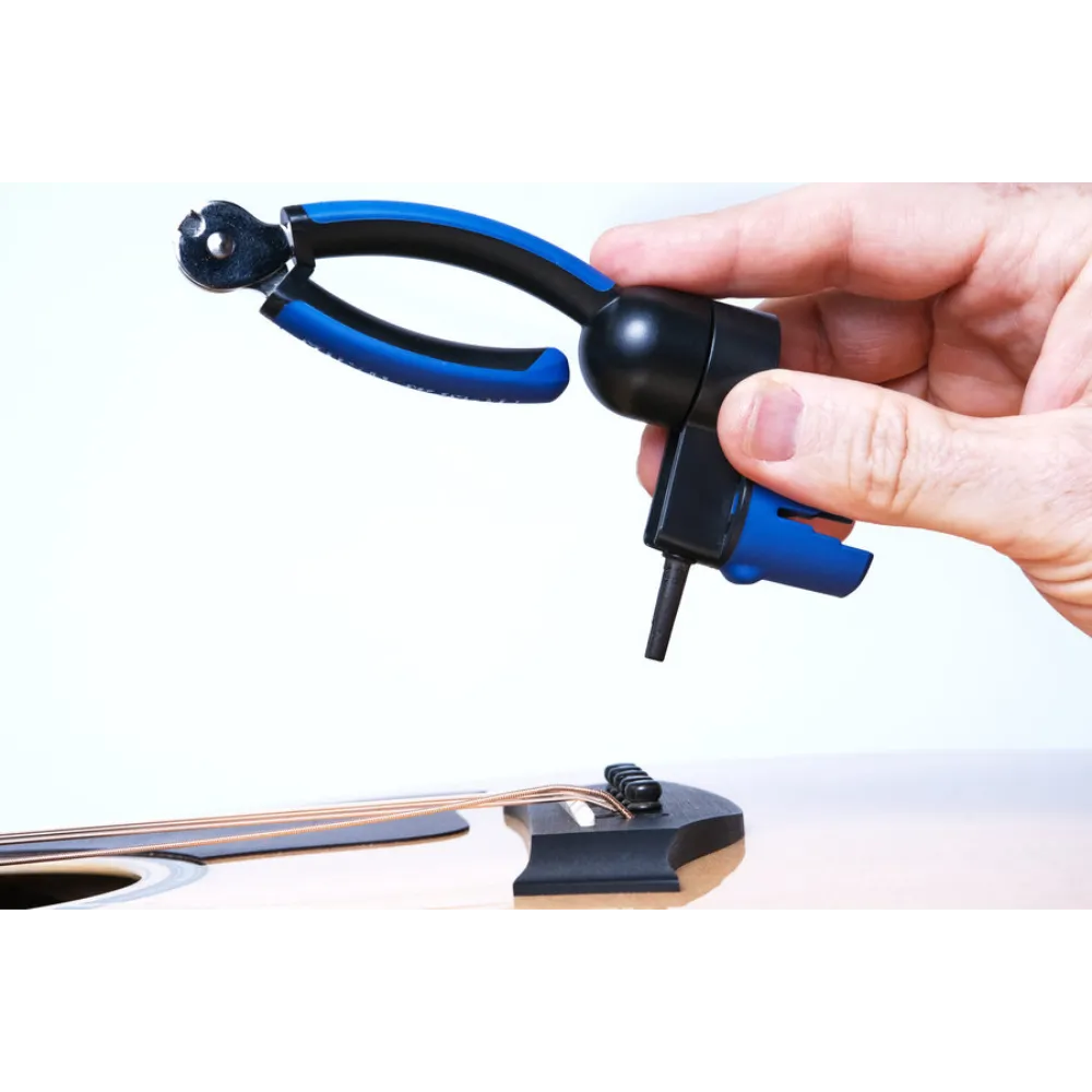 Simply slide under the pin & pull straight up