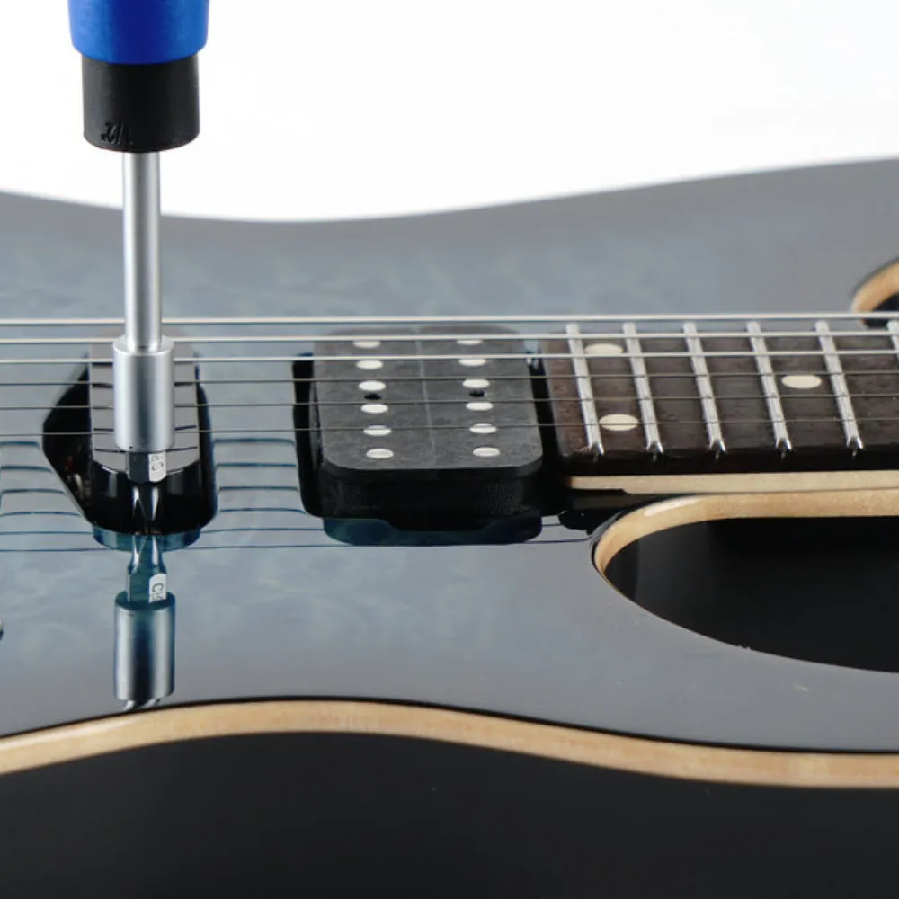 Screwdriver for adjusting pick up height