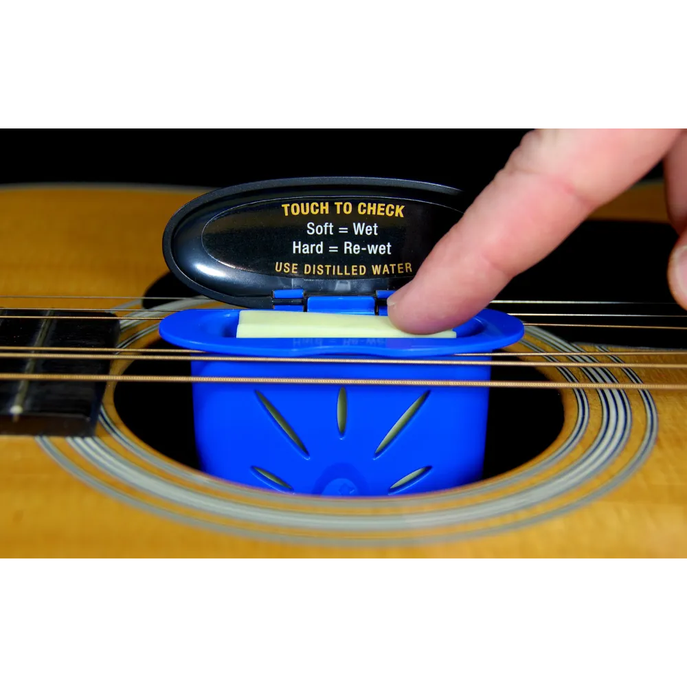 4 (1) MN300: The Humitar - Acoustic Guitar Soundhole Humidifier Humitar Guitar Humidifier hangs from strings.