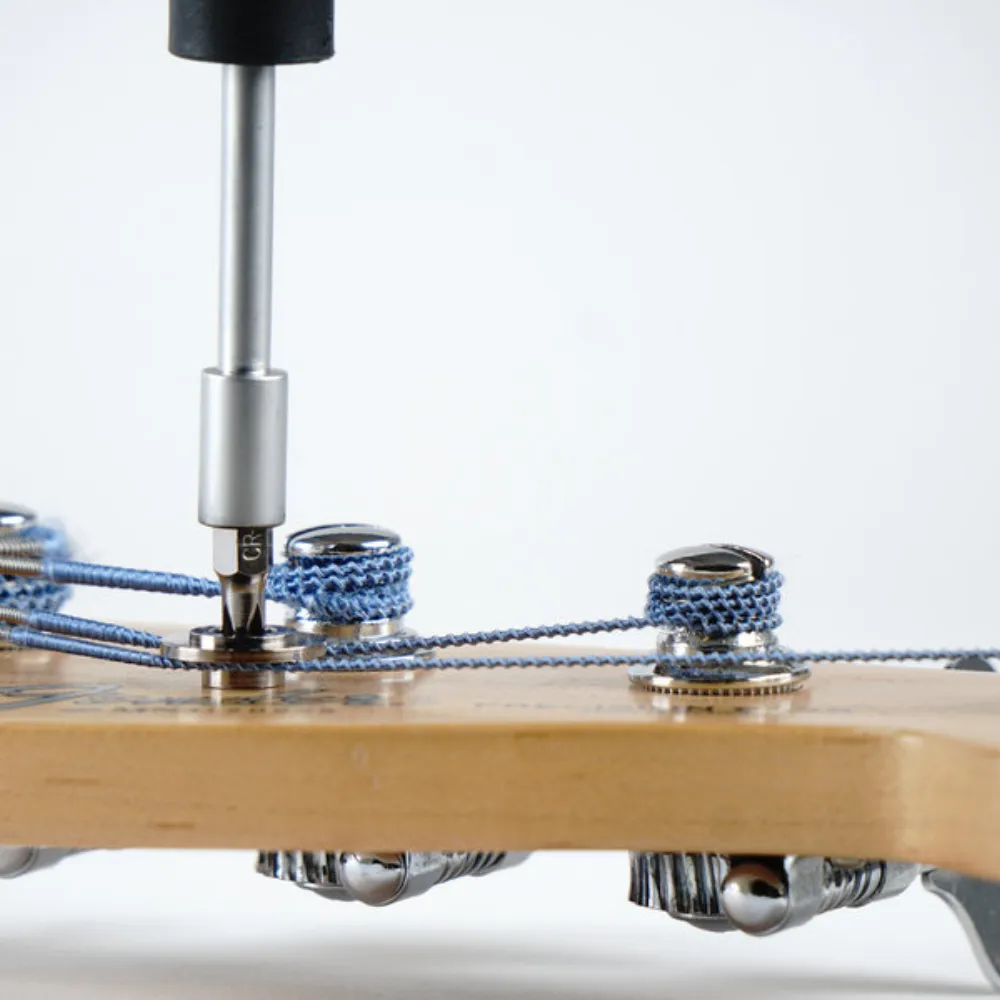 Screwdriver to adjust bass string guides