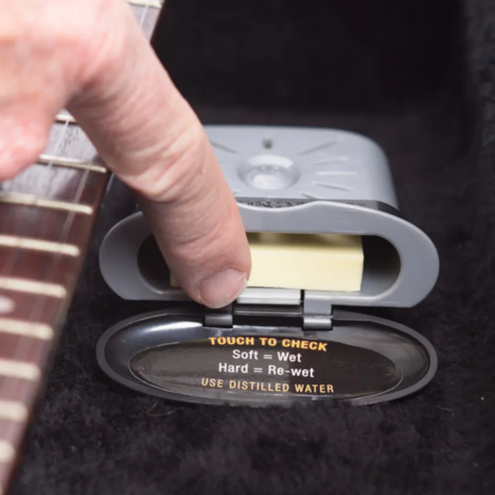 Guitar Case Humidifier slides in and out of holster