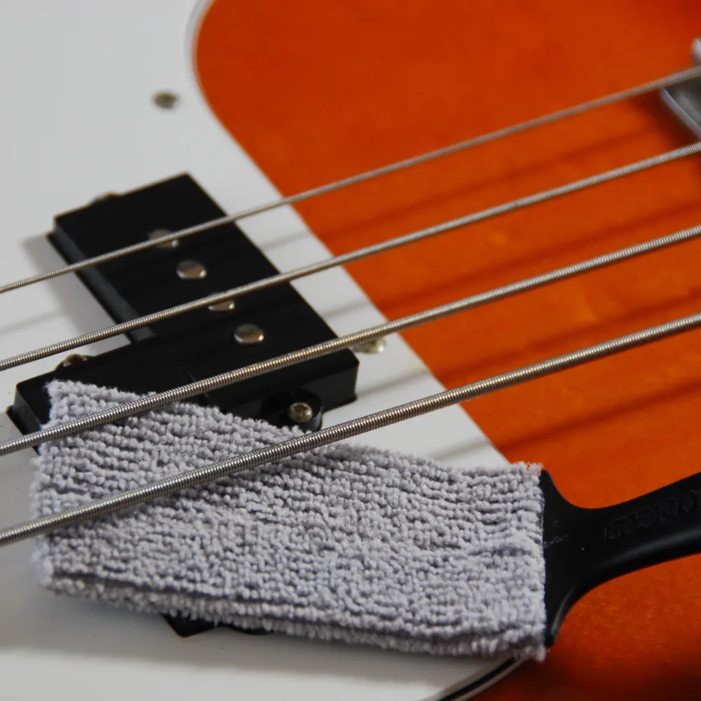 cleans dust from guitar pickups